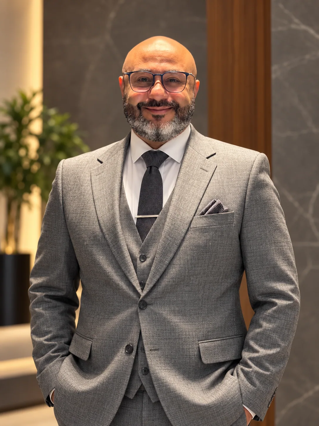 Karim Serageldin in a gray business suit